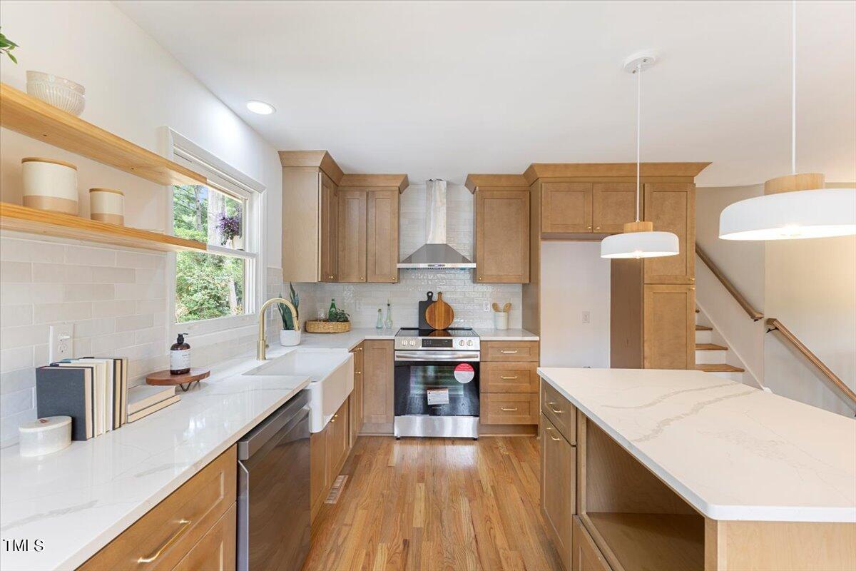 134 Radcliff Circle Durham, NC 27713 - Photo 9 of 37 a kitchen with a sink stove top oven and cabinets