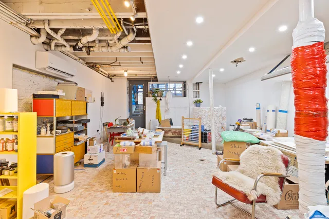 a view of a livingroom with washer and dryer