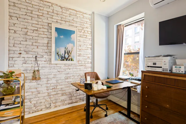 a view of swimming pool with outdoor seating and plants