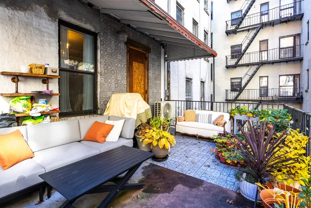 a outdoor living space with furniture and a potted plant