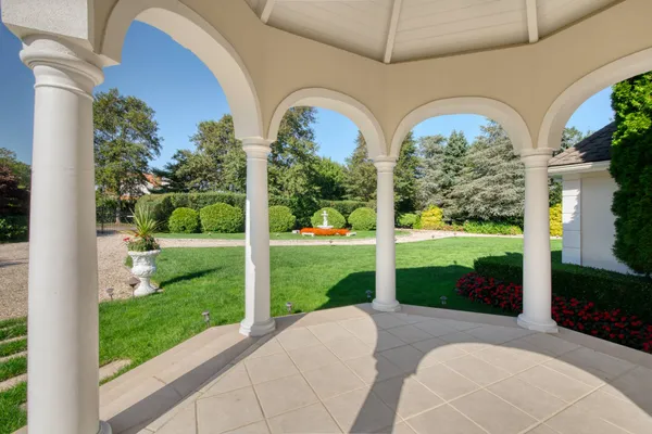 a view of a garden with a swimming pool