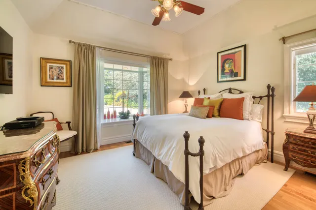 a bedroom with a bed and a cabinets