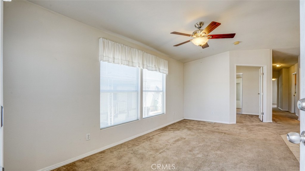 416 Jeffries, Unit 60 Monrovia, CA 91016 - Photo 11 of 49 a view of empty room with window and a ceiling fan