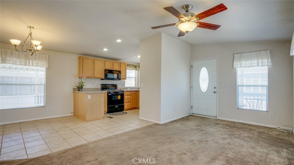 416 Jeffries, Unit 60 Monrovia, CA 91016 - Photo 12 of 49 a view of a kitchen with furniture a ceiling fan and fire place