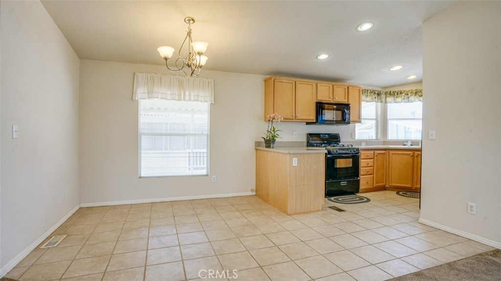 416 Jeffries, Unit 60 Monrovia, CA 91016 - Photo 14 of 49 a kitchen that has a sink and a stove in it
