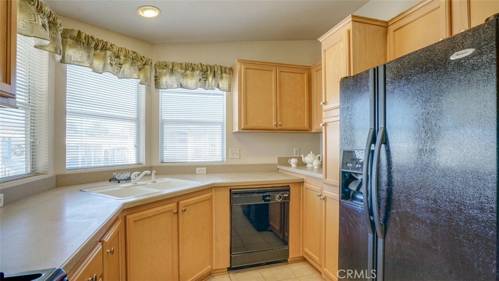 416 Jeffries, Unit 60 Monrovia, CA 91016 - Photo 20 of 49 a kitchen with stainless steel appliances granite countertop a sink and a refrigerator