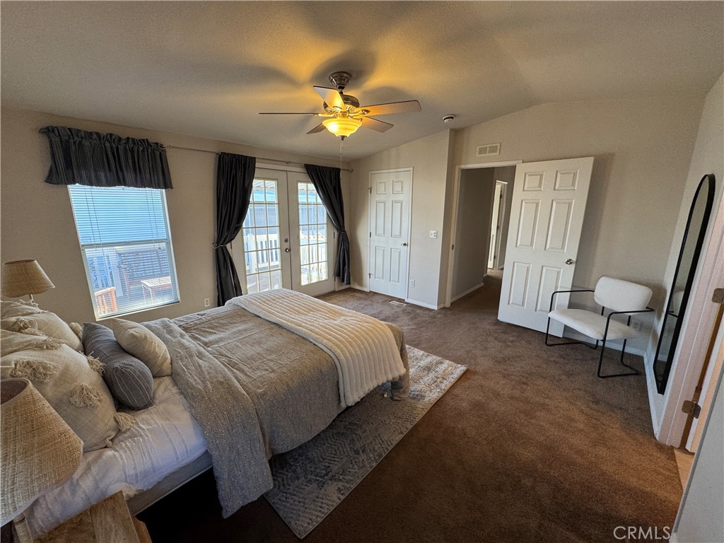 416 Jeffries, Unit 60 Monrovia, CA 91016 - Photo 29 of 49 a spacious bedroom with a bed and a chandelier