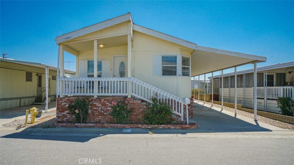 416 Jeffries, Unit 60 Monrovia, CA 91016 - Photo 3 of 49 a view of a house with a small yard and wooden fence