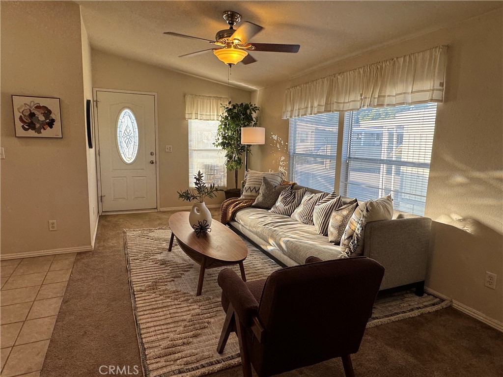 416 Jeffries, Unit 60 Monrovia, CA 91016 - Photo 5 of 49 a living room with furniture a chandelier and a window