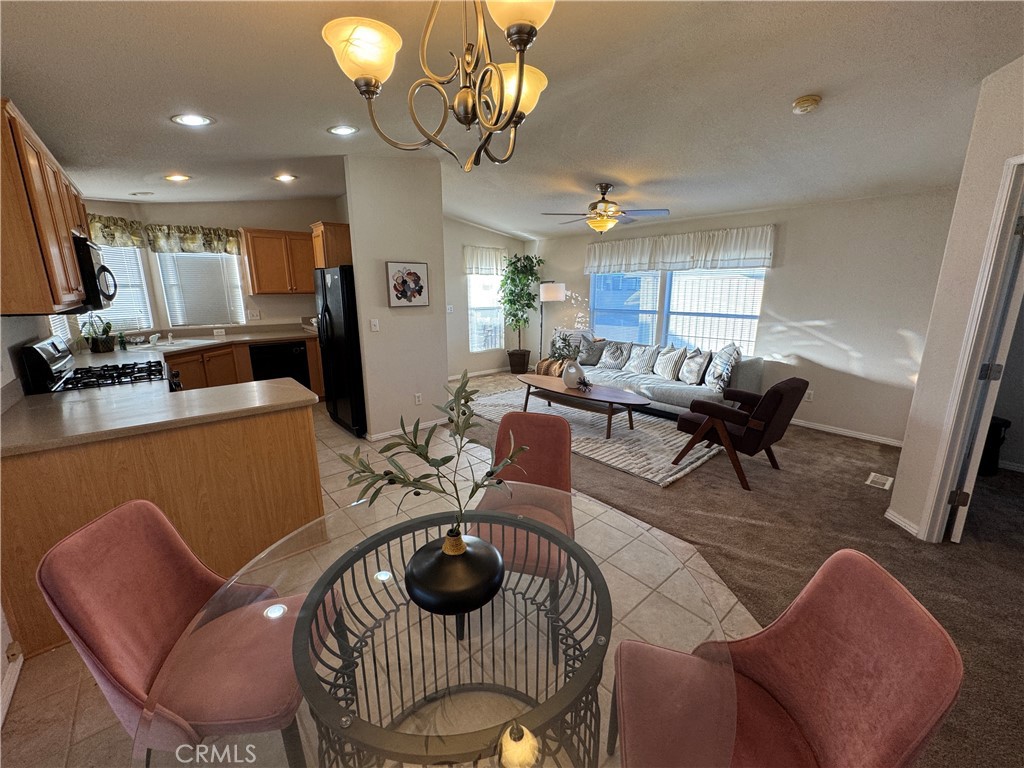 416 Jeffries, Unit 60 Monrovia, CA 91016 - Photo 7 of 49 a living room with furniture kitchen view and a chandelier