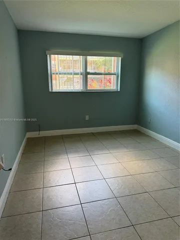 a view of a room that has a window in it