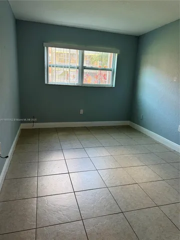 an empty room with a empty space and window
