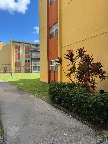 a view of a house with a street