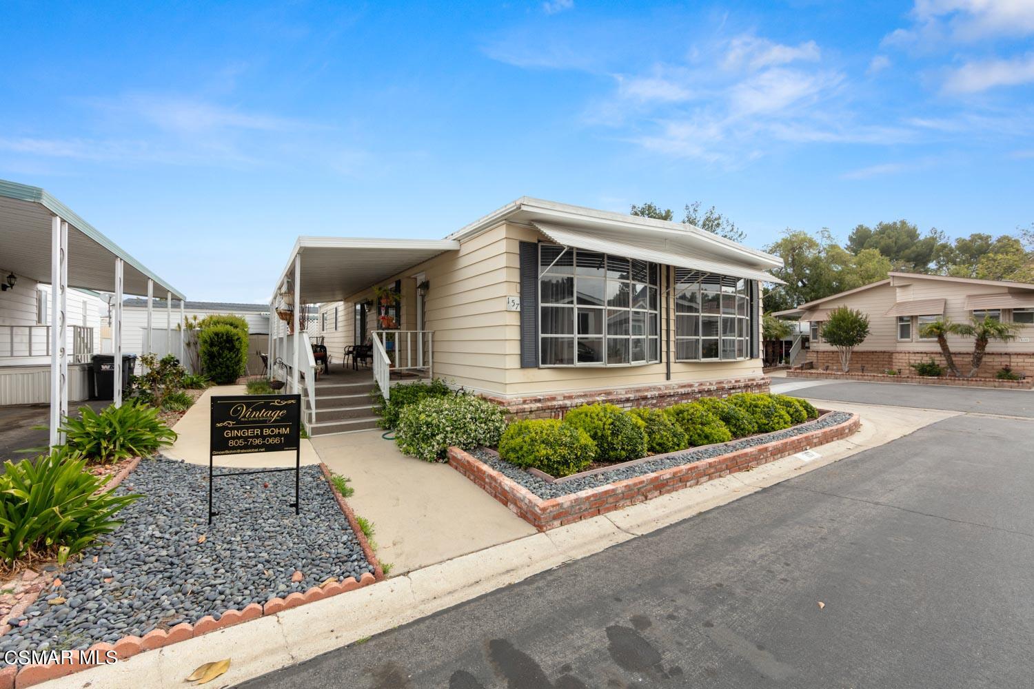 195 Tierra Rejada Road, Unit 157 Simi Valley, CA 93065 - Photo 1 of 27 a house view with a garden space