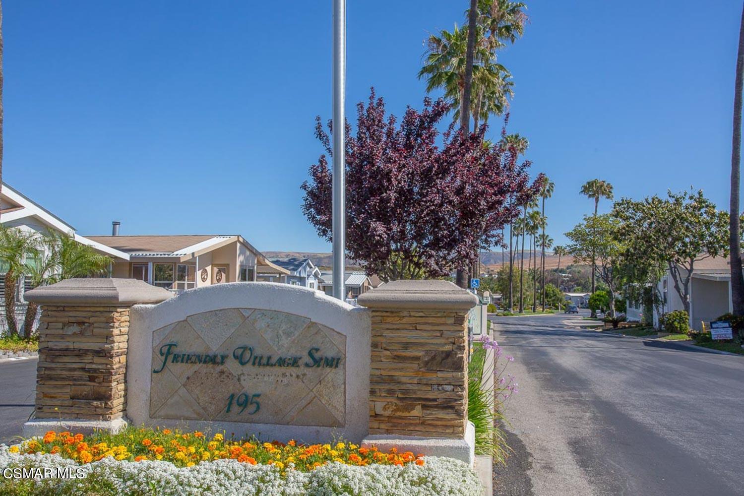 195 Tierra Rejada Road, Unit 157 Simi Valley, CA 93065 - Photo 2 of 27 a front view of a house with a yard