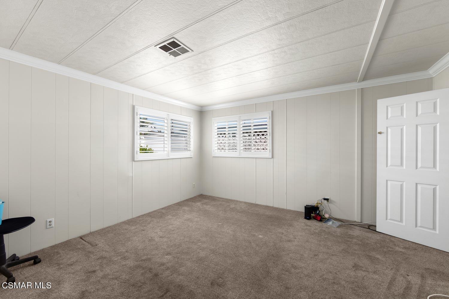 195 Tierra Rejada Road, Unit 157 Simi Valley, CA 93065 - Photo 22 of 27 an empty room with windows
