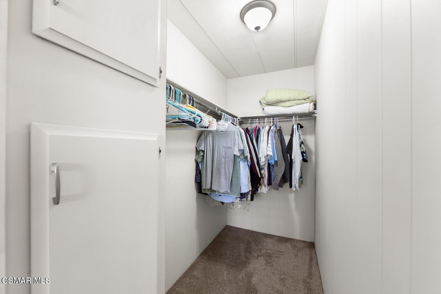 195 Tierra Rejada Road, Unit 157 Simi Valley, CA 93065 - Photo 24 of 27 a view of walk in closet with clothes