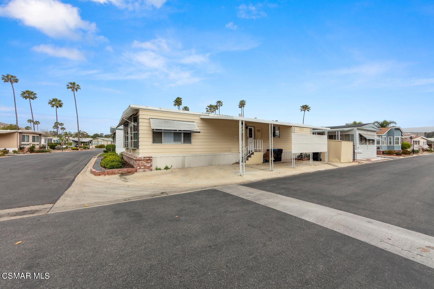 195 Tierra Rejada Road, Unit 157 Simi Valley, CA 93065 - Photo 4 of 27 a view of a street with a building in the background