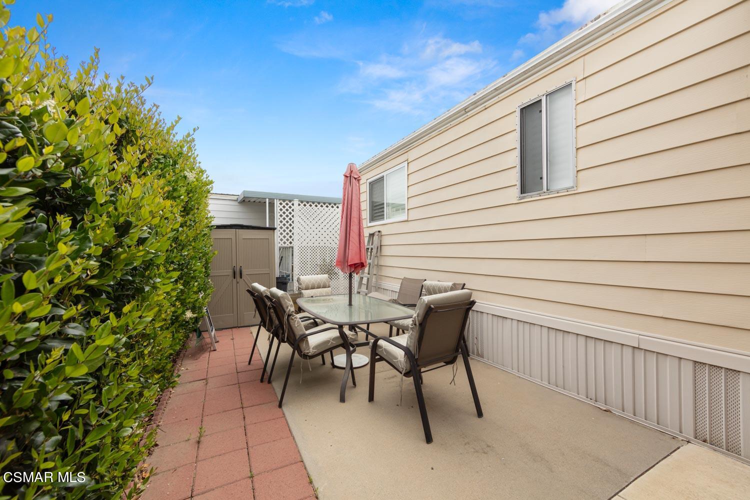 195 Tierra Rejada Road, Unit 157 Simi Valley, CA 93065 - Photo 7 of 27 a patio with table and chairs and potted plants