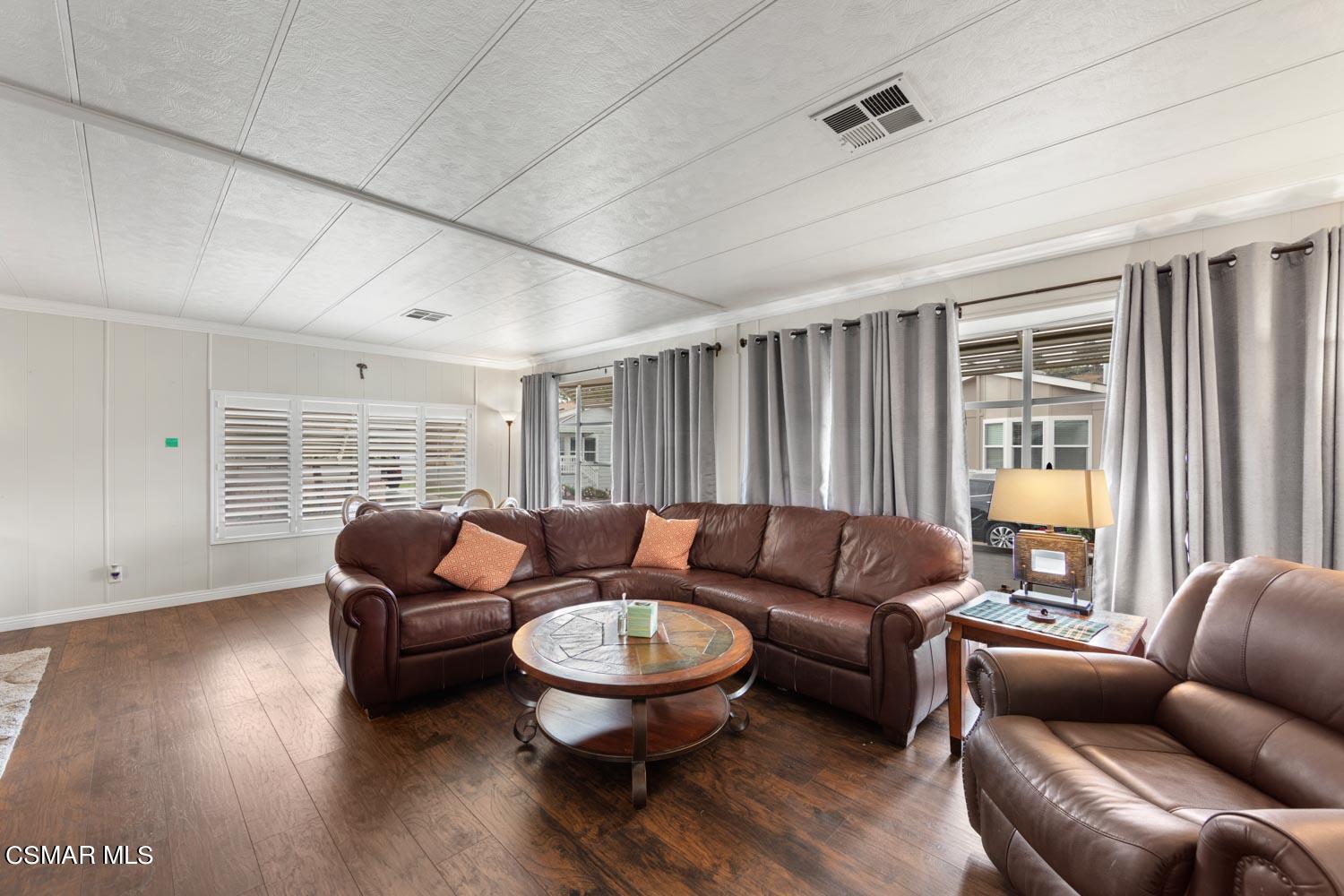 195 Tierra Rejada Road, Unit 157 Simi Valley, CA 93065 - Photo 8 of 27 a living room with furniture and a large window