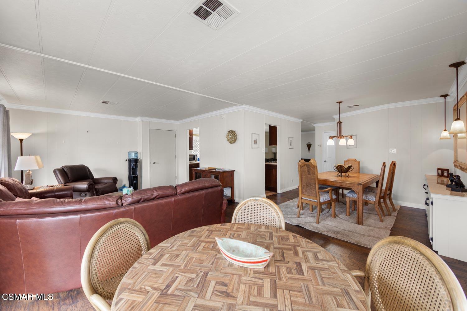 195 Tierra Rejada Road, Unit 157 Simi Valley, CA 93065 - Photo 10 of 27 a living room with furniture and a chandelier
