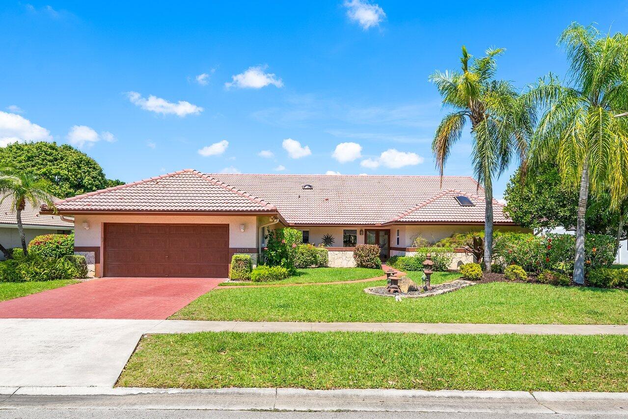 10215 Boca Woods Lane Boca Raton, FL 33428 - Photo 1 of 22 001-10215BocaWoodsLane-BocaRaton-FL-3342