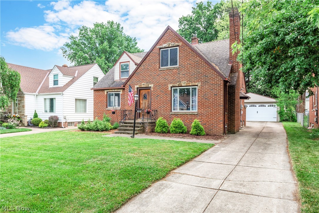 21779 Eaton Road Cleveland, OH 44126 - Photo 2 of 46 View of front of home with a front lawn, a garage, and an outdoor structure