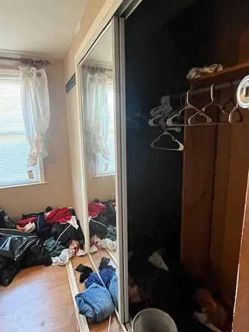 a room with gym equipment and a large window