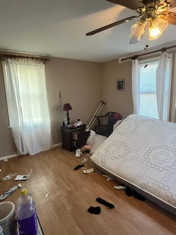 a room with a bed and window