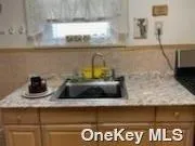 a close view of sink and microwave