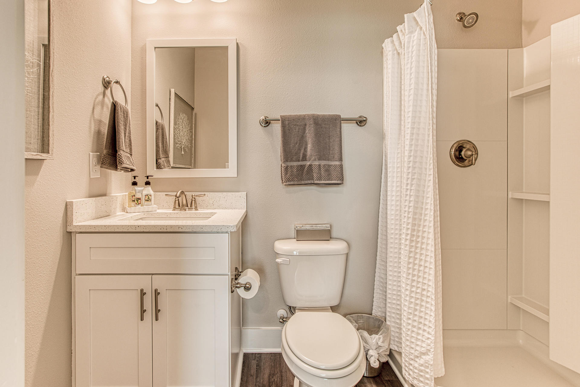 302 North Sand Palm Road, Unit 150VISTA Freeport, FL 32439 - Photo 20 of 24 a bathroom with a toilet sink shower and mirror