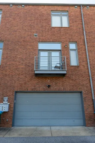 a view of a brick house with stairs