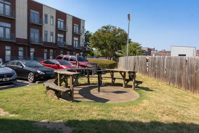 a swimming pool with outdoor seating and yard