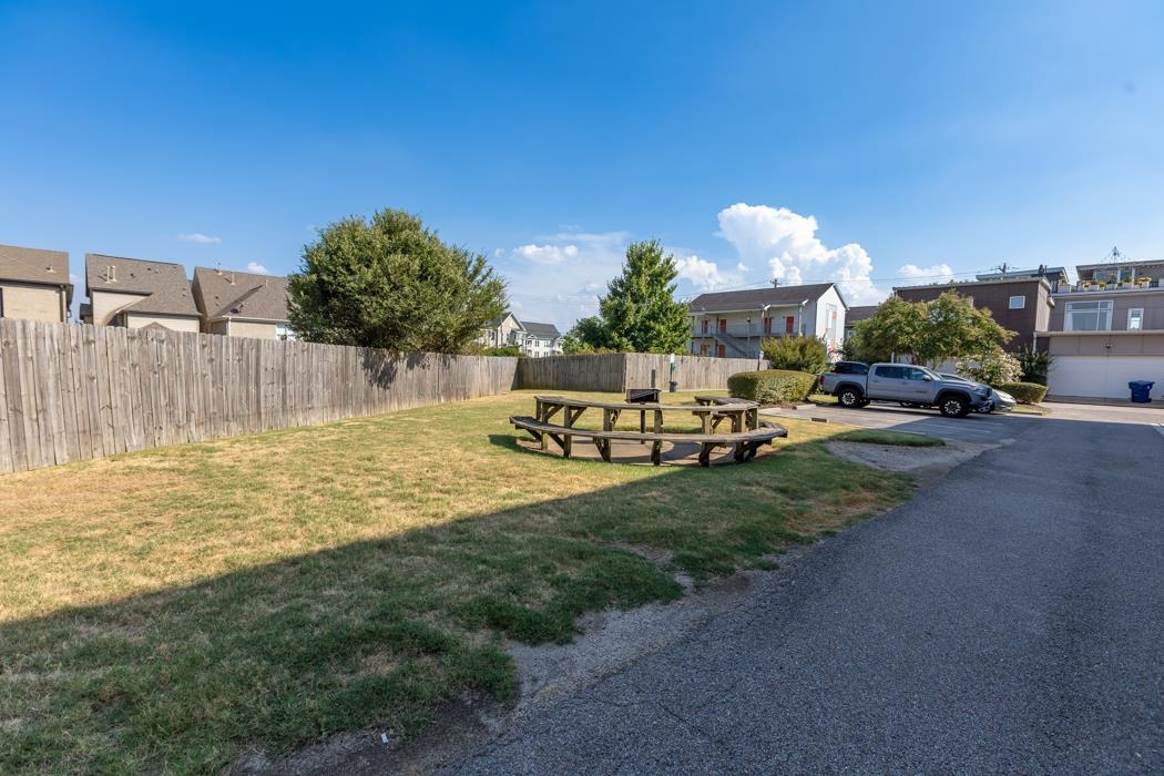 616 Denmark Drive, Unit 106 Memphis, TN 38103 - Photo 28 of 34 a row of palm trees and a yard