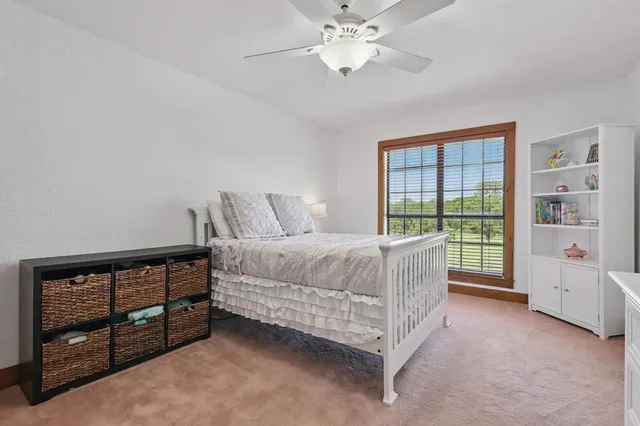 a bedroom with furniture and a window