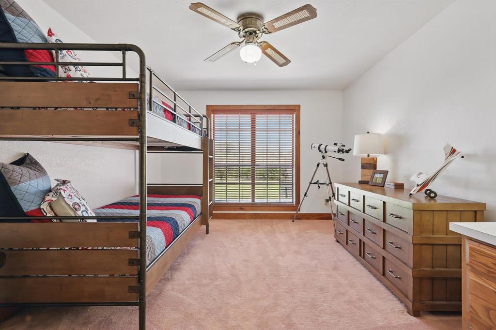 1189 West Jeter Road Bartonville, TX 76226 - Photo 18 of 40 a bedroom with furniture and a window