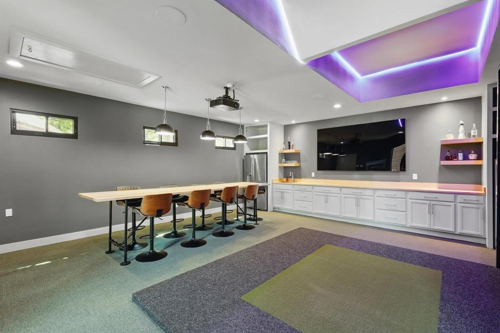 1189 West Jeter Road Bartonville, TX 76226 - Photo 20 of 40 a room with furniture and a flat screen tv