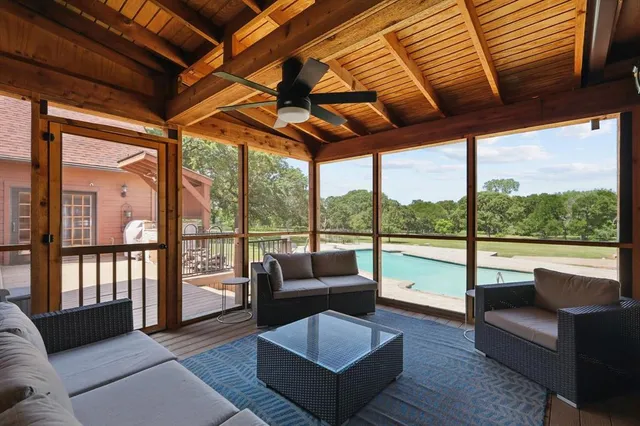 a view of swimming pool with seating space