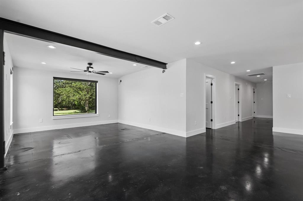 1189 West Jeter Road Bartonville, TX 76226 - Photo 27 of 40 a view of an empty room with wooden floor and a window