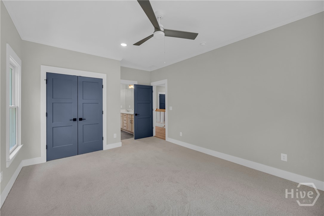2476 St Martin Way Monroe, GA 30656 - Photo 63 of 75 Carpeted room featuring a ceiling fan, recessed lighting, and a window