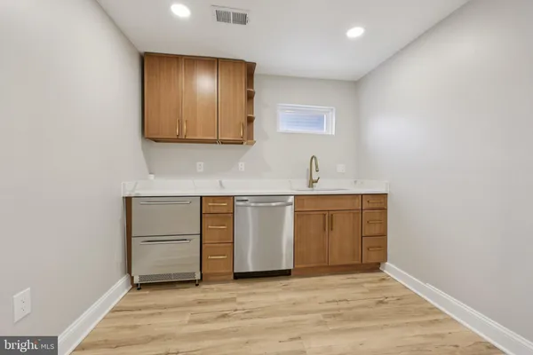 a view of a kitchen with sink and dishwasher