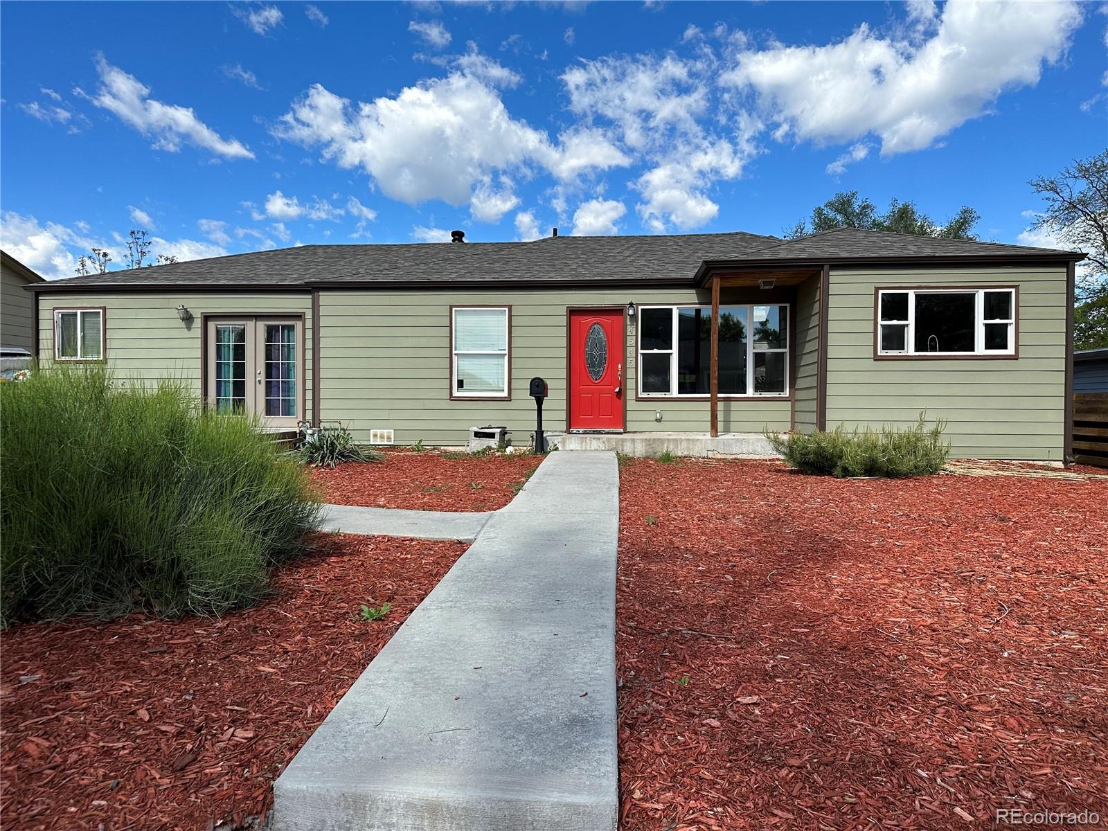 front view of a house with a yard