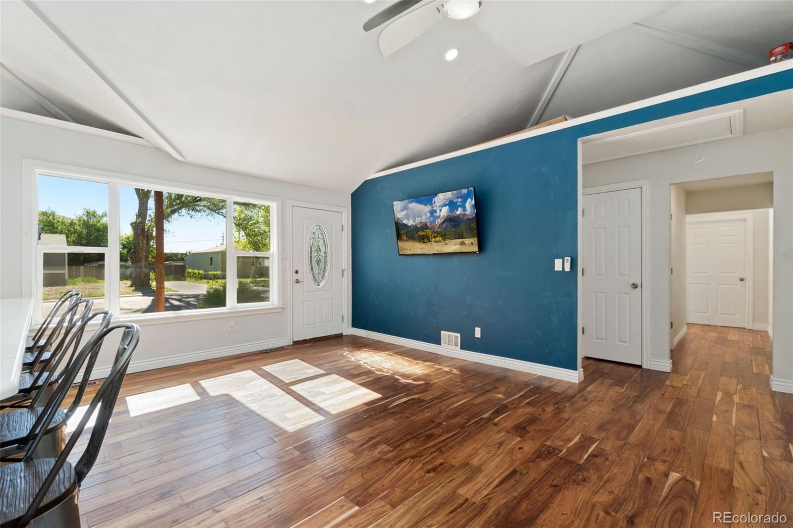 4545 Ingalls Street Wheat Ridge, CO 80033 - Photo 15 of 30 a view of empty room with wooden floor and fan