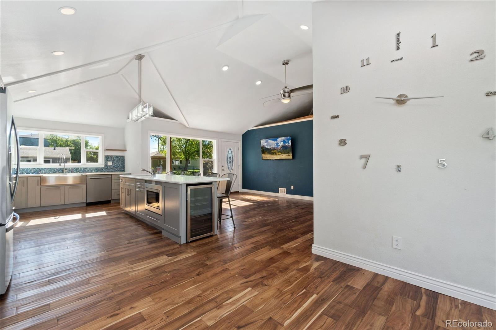4545 Ingalls Street Wheat Ridge, CO 80033 - Photo 16 of 30 a view of a kitchen with cabinets and wooden floor