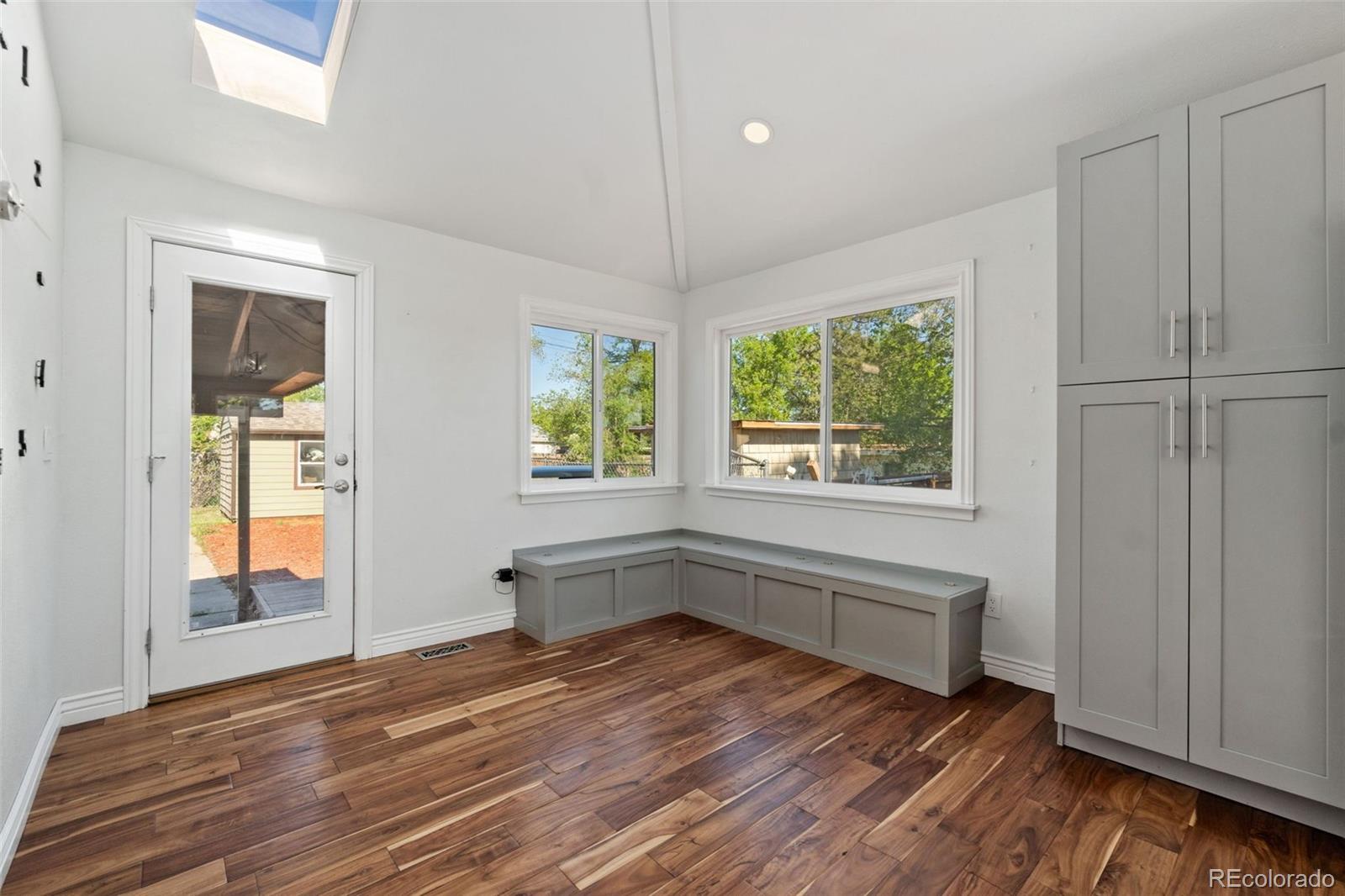 4545 Ingalls Street Wheat Ridge, CO 80033 - Photo 17 of 30 a view of an empty room with wooden floor and a window
