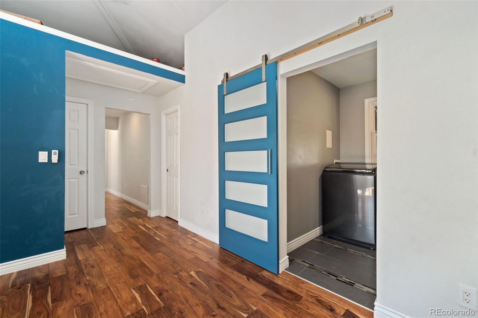 4545 Ingalls Street Wheat Ridge, CO 80033 - Photo 18 of 30 hallway with wooden floor and closet