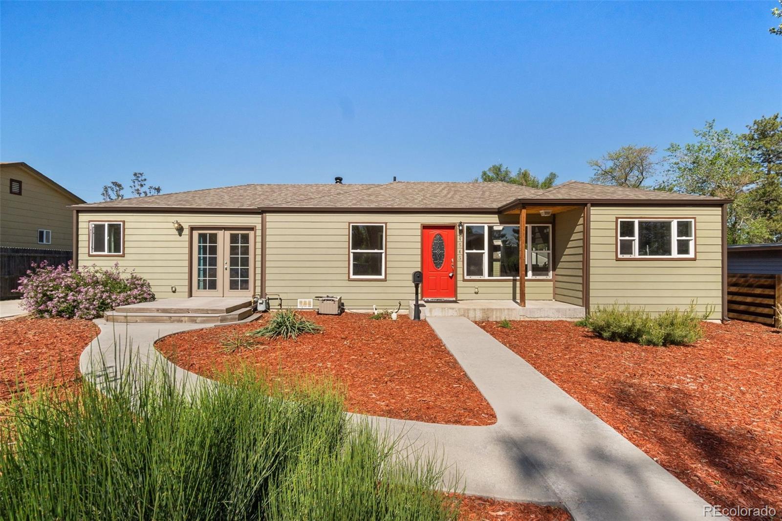 4545 Ingalls Street Wheat Ridge, CO 80033 - Photo 2 of 30 a front view of a house with yard porch and outdoor seating