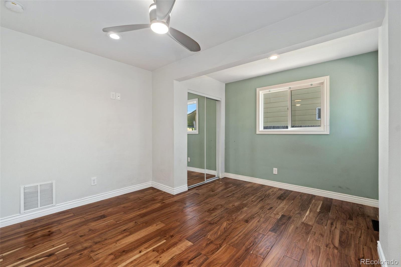 4545 Ingalls Street Wheat Ridge, CO 80033 - Photo 21 of 30 wooden floor in an empty room with a window