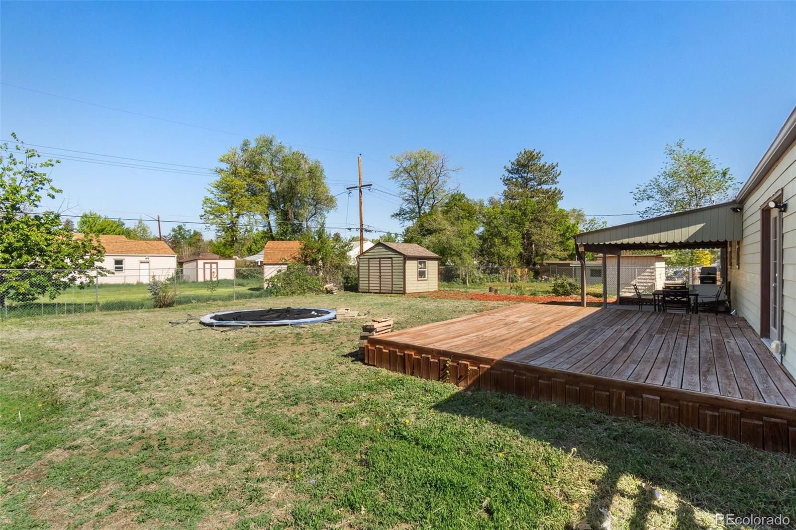 4545 Ingalls Street Wheat Ridge, CO 80033 - Photo 28 of 30 a view of a house with swimming pool yard and sitting area