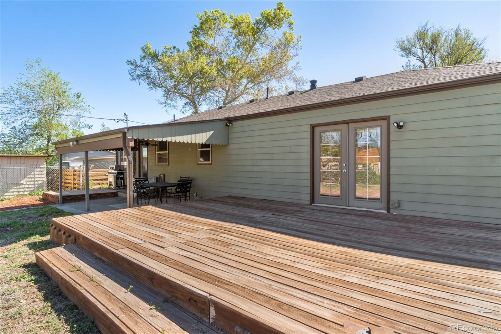 4545 Ingalls Street Wheat Ridge, CO 80033 - Photo 29 of 30 a front view of a house with garden